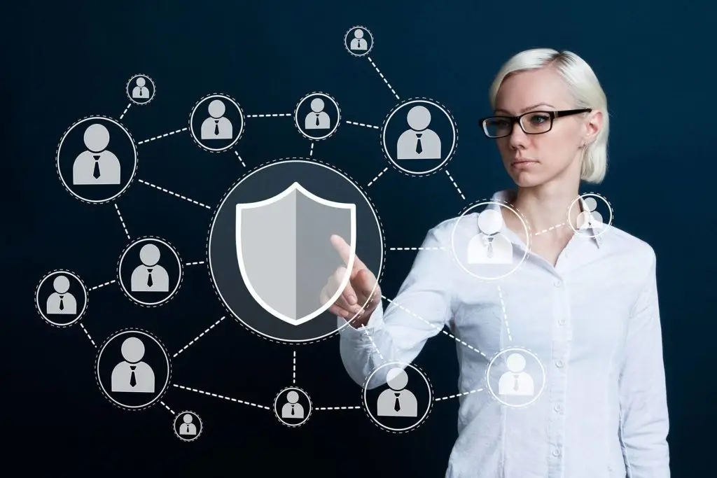 Professional Woman Ensuring Cybersecurity In Digital Network With Shield Symbol, Safeguarding Connections. professional woman ensuring cybersecurity in digital network with shield symbol, safeguarding connections.