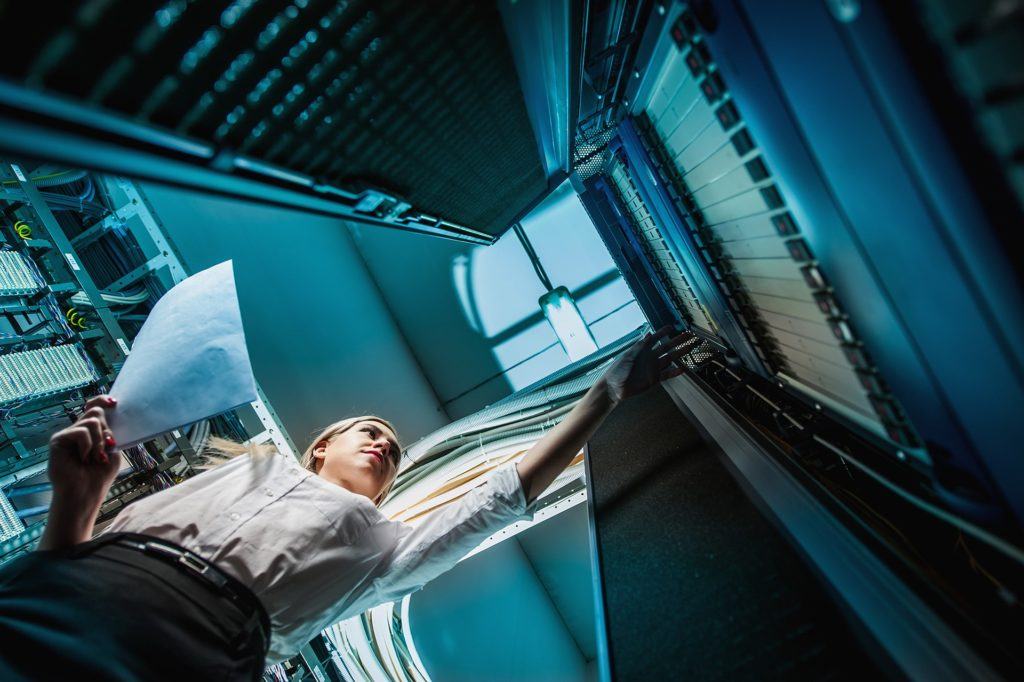 futuristic data center troubleshoots, showcasing collaboration between human intellect and machine efficiency. network security.