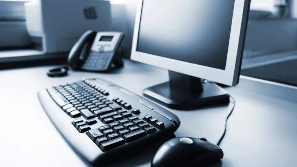 Modern Office Setup With Sleek Computer, Keyboard, Mouse, Monitor, And Phone For Productivity. modern office setup with sleek computer, keyboard, mouse, monitor, and phone for productivity.