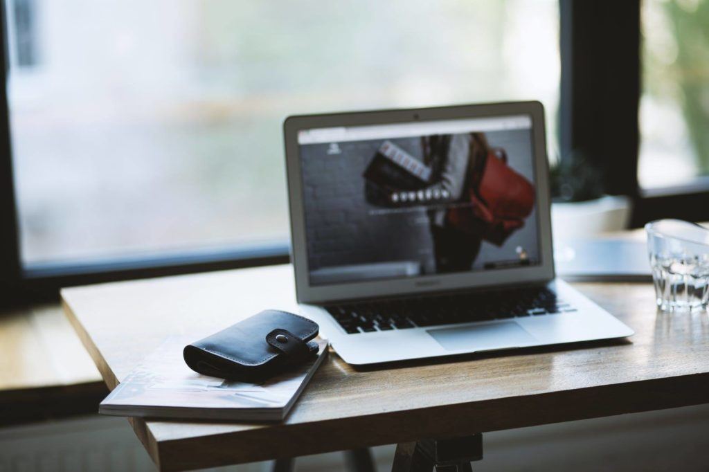 tranquil workspace with laptop, wallet, and natural light for productivity and inspiration. tips