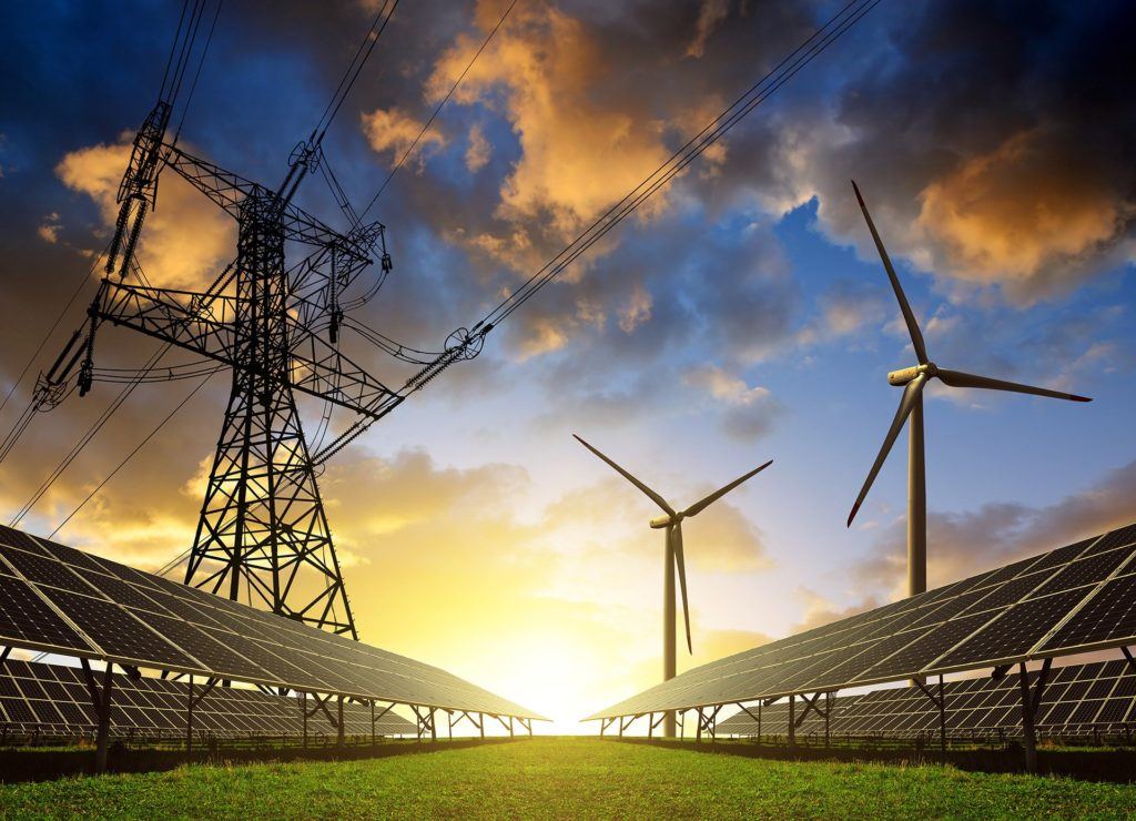 renewable energy landscape at sunset with solar panels, wind turbines, and transmission tower. solar power