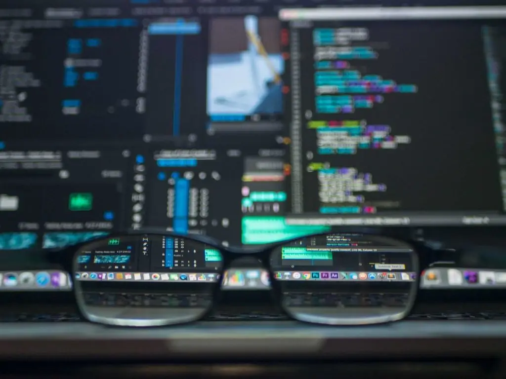 Stylish Glasses Reflecting Vibrant Code On Laptop Screen, Symbolizing Tech-Savvy Workspace. Internet. stylish glasses reflecting vibrant code on laptop screen, symbolizing tech-savvy workspace. internet.