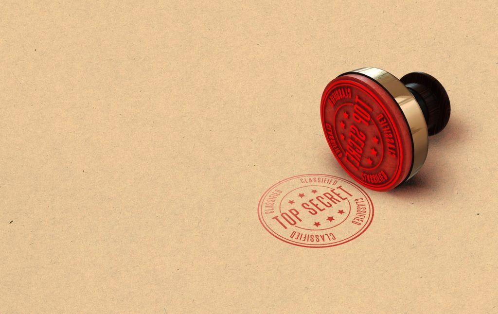 classic top secret red stamp on kraft paper background for confidentiality and authority. watermark.