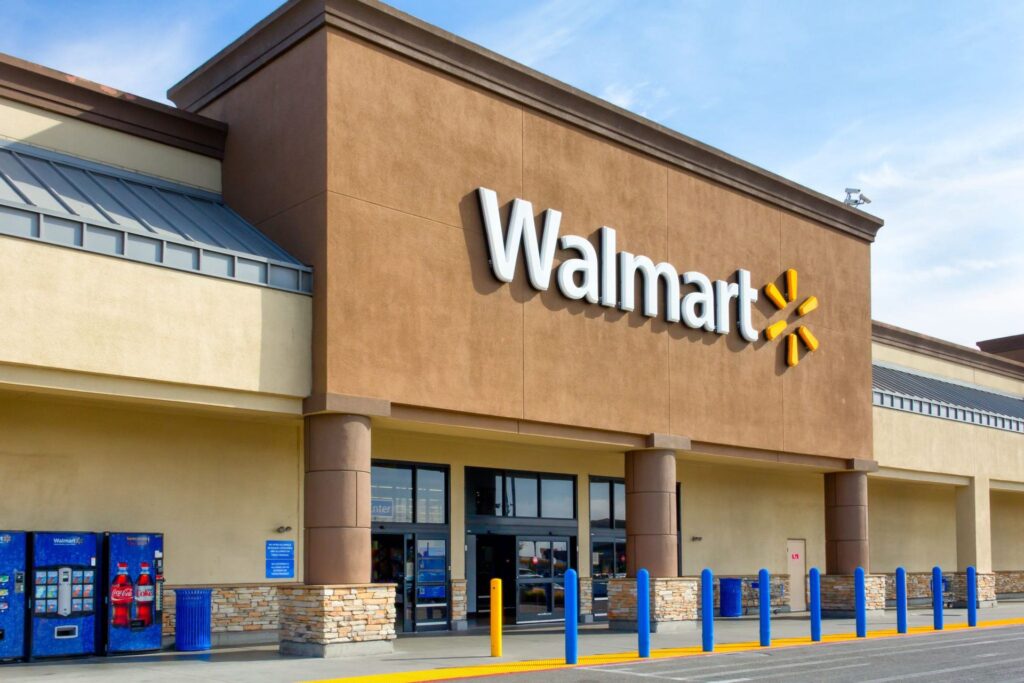 modern walmart store entrance with iconic logo, blue bollards, and inviting design. privacy.