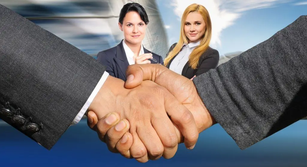 Empowering Women In Business: Strong Handshake Symbolizing Partnership And Collaboration. Business Relationships. empowering women in business: strong handshake symbolizing partnership and collaboration. business relationships.