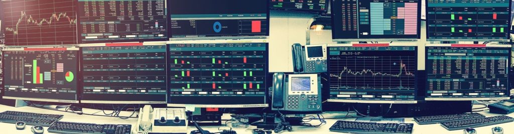 sophisticated financial trading setup with multiple screens displaying real-time market data. remote monitoring.