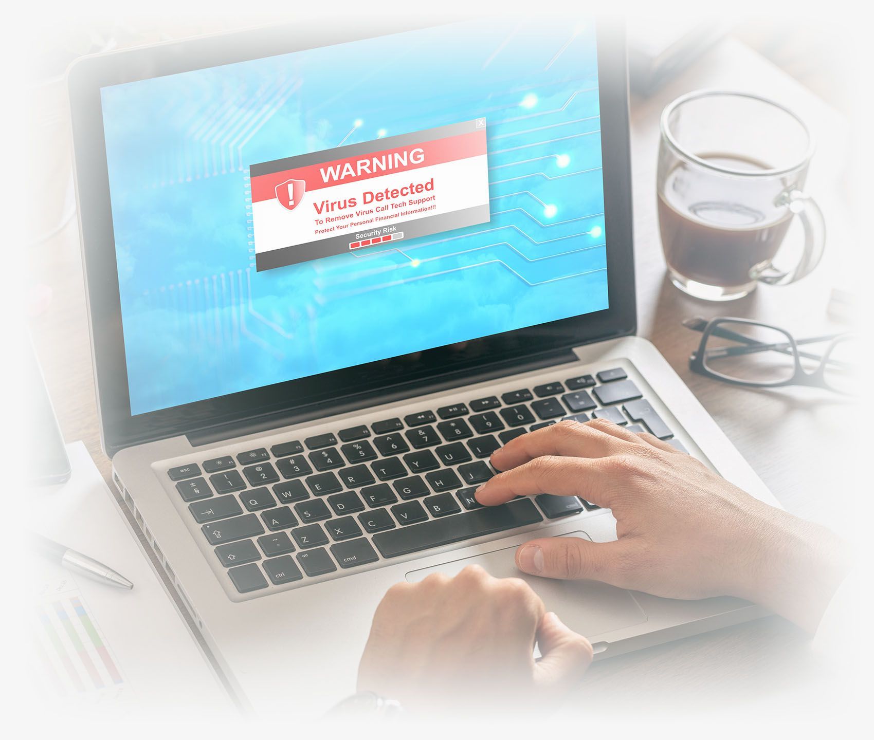 Man working with a laptop. Virus alert on the screen Managed Security