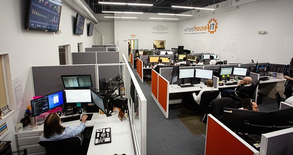 an office filled with people working on computers