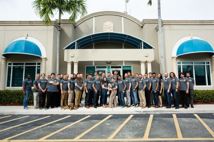 a group of people standing in front of a building