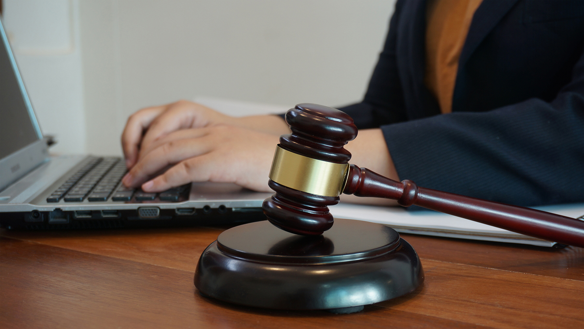 a judge's gaven sitting on top of a laptop computer