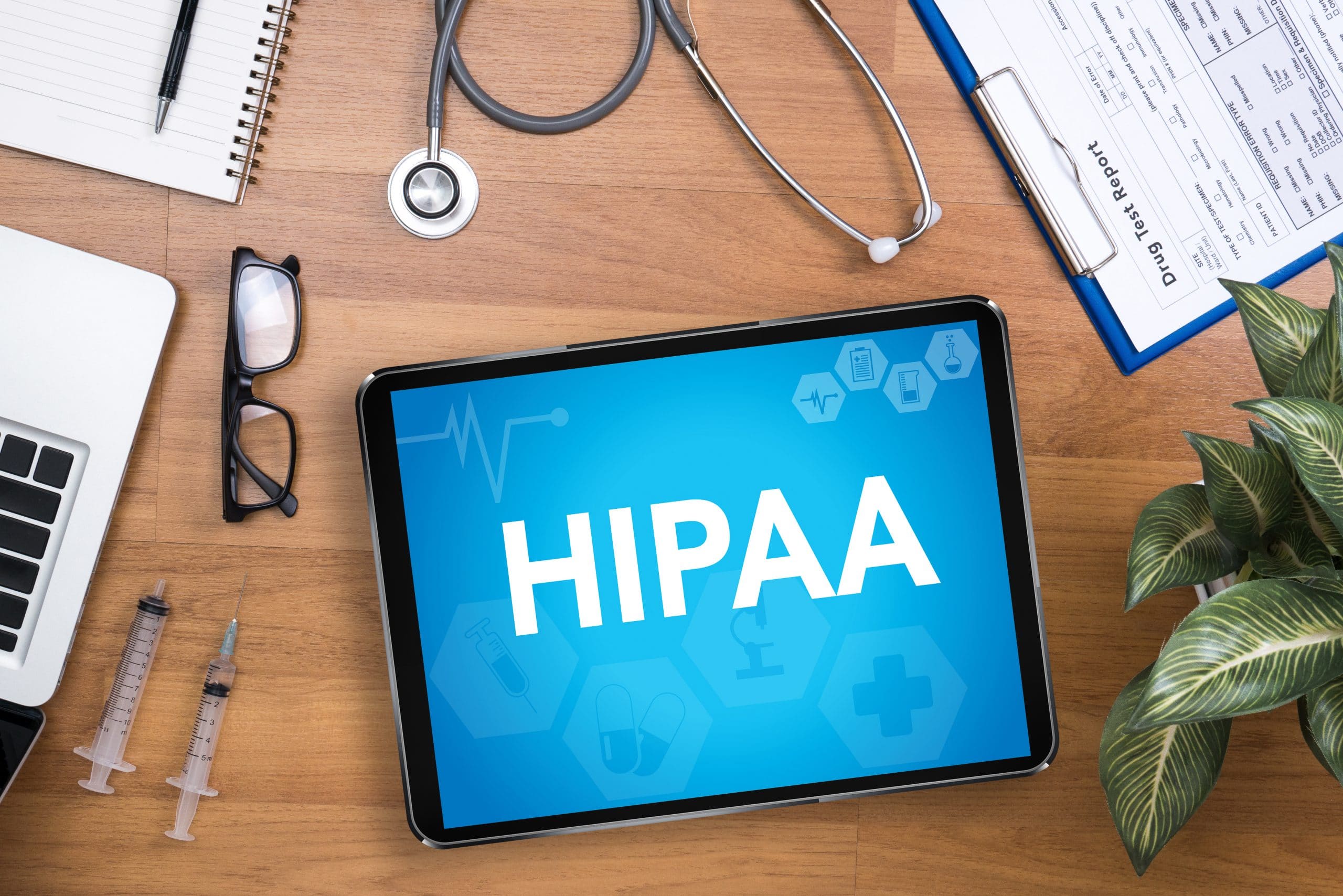 a tablet with the word hipaa on it