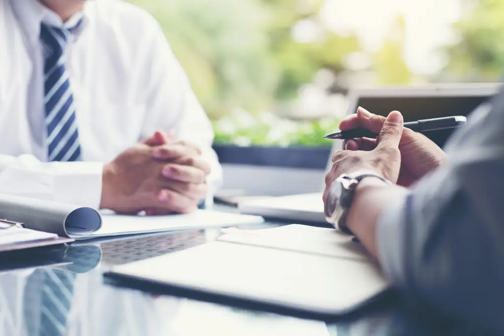 Productive Business Meeting In Modern Workspace With Professionals Engaging In Strategic Collaboration. productive business meeting in modern workspace with professionals engaging in strategic collaboration.