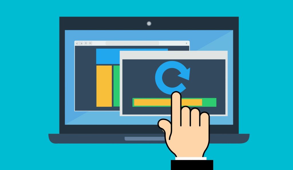 analyzing data on laptop with colorful charts in modern setting.