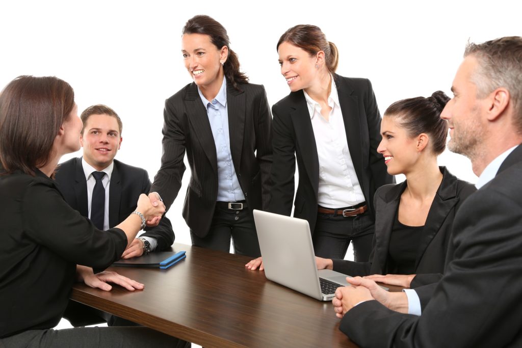 successful womens handshake signifies collaboration and professionalism in modern business setting.