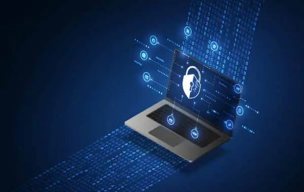 a laptop with a shield on the screen