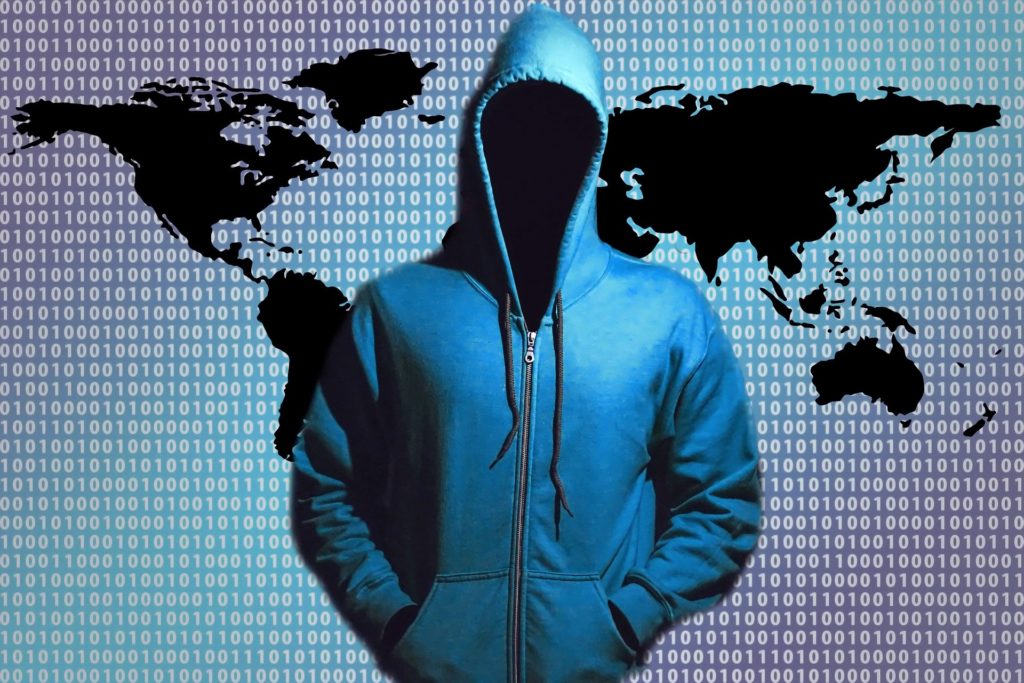 unveiling the cyber enigma: mysterious figure in blue hoodie with binary code map
