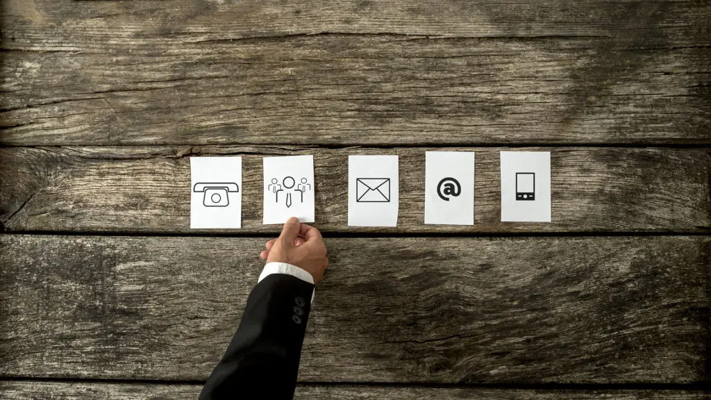 Evolution Of Communication Icons From Camera To Smartphone On Rustic Wooden Cards. evolution of communication icons from camera to smartphone on rustic wooden cards.