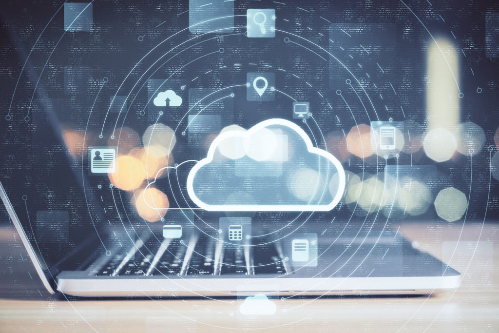 digital connectivity: laptop with cloud symbol and tech icons.