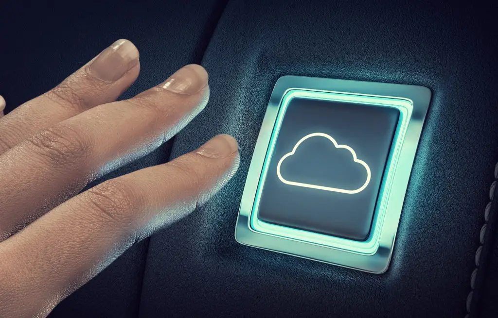 reaching out to the future: engaging with cloud technology through a sleek button.