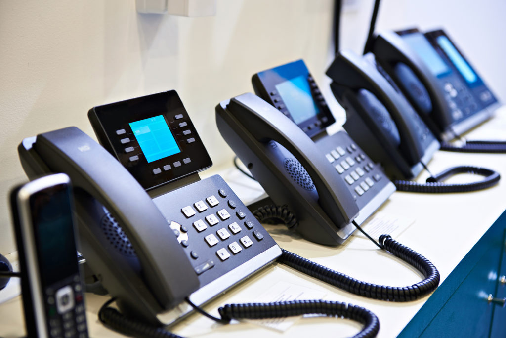 sleek black office phones for efficient communication in a professional setting.