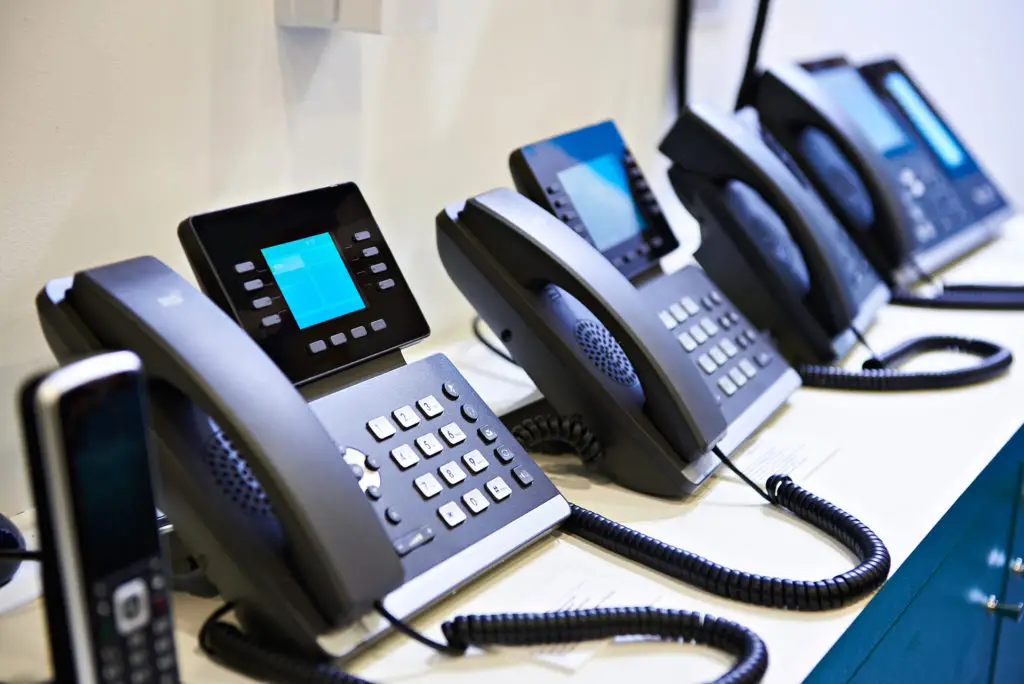 Sleek Black Office Phones For Efficient Communication In A Professional Setting. sleek black office phones for efficient communication in a professional setting.