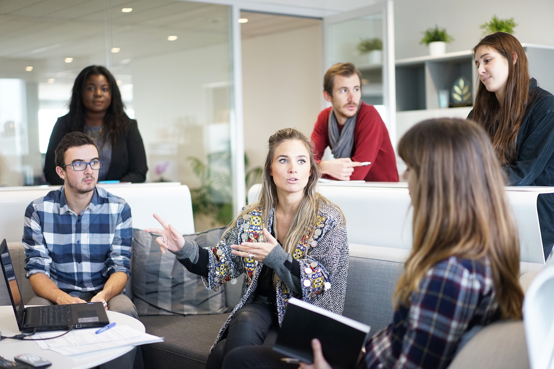creative professionals collaborating in modern office, fostering teamwork and innovation.