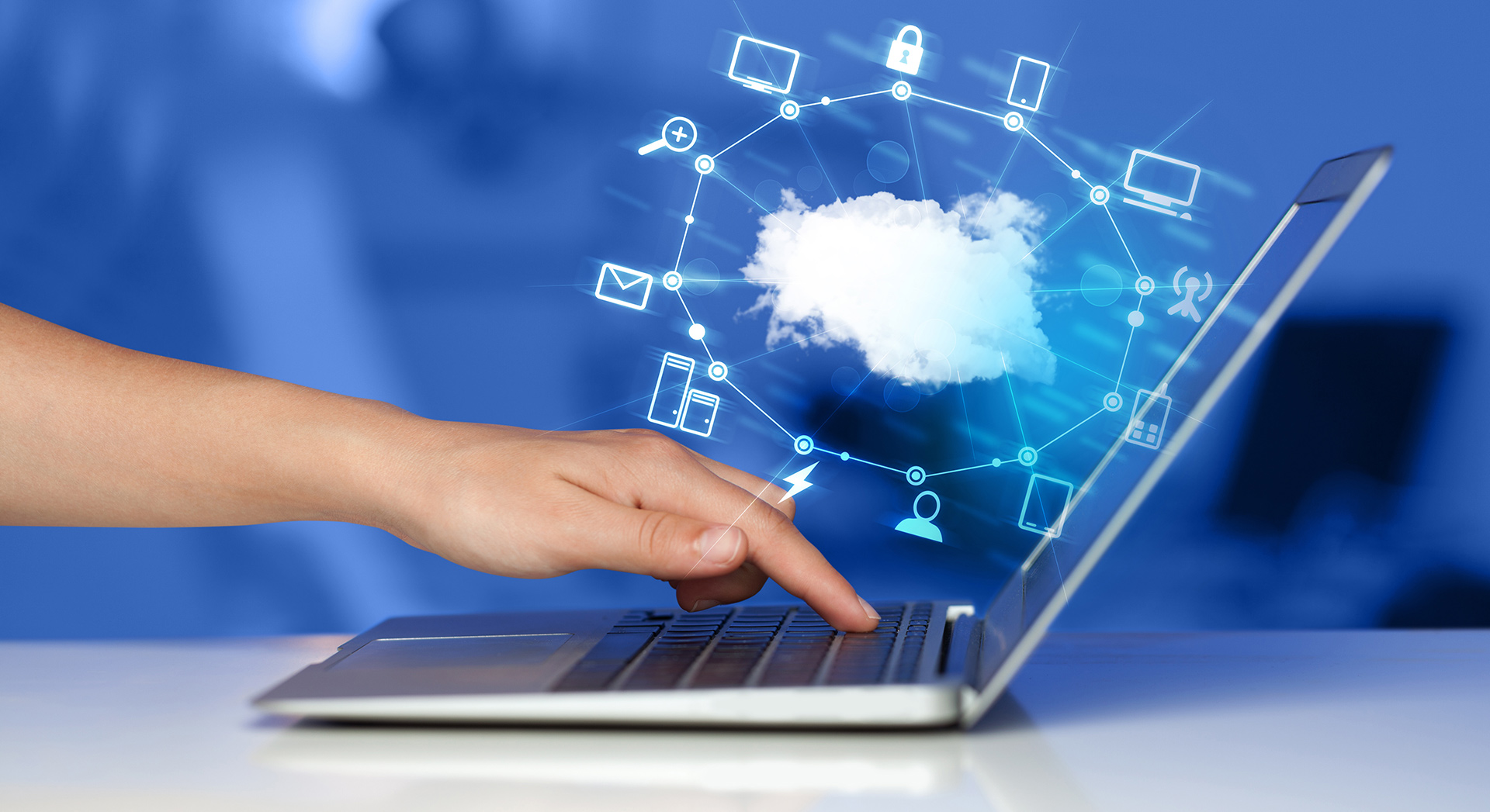a person touching a cloud on top of a laptop