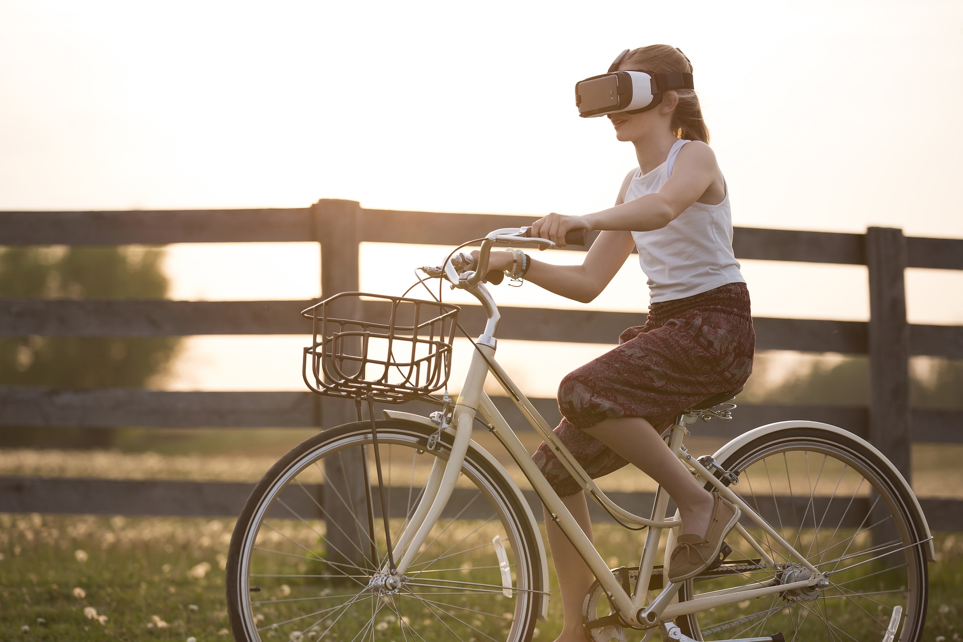 a woman riding a bike wearing a virtual headset