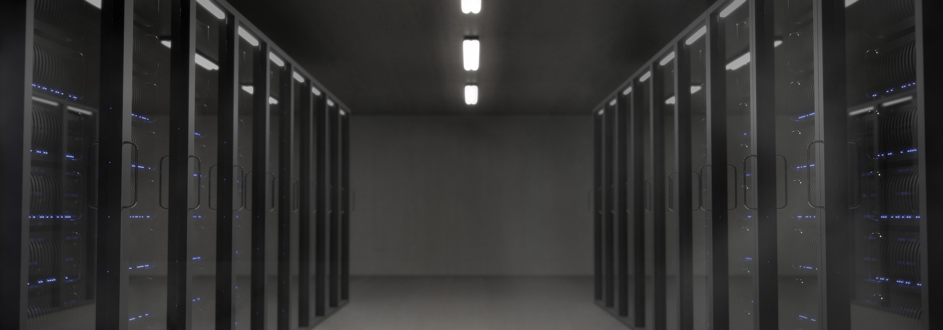 a long hallway with rows of servers in it