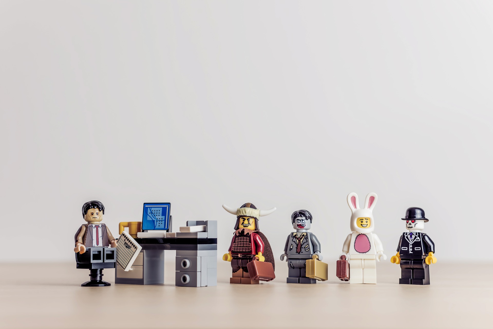 a group of lego figures standing next to each other
