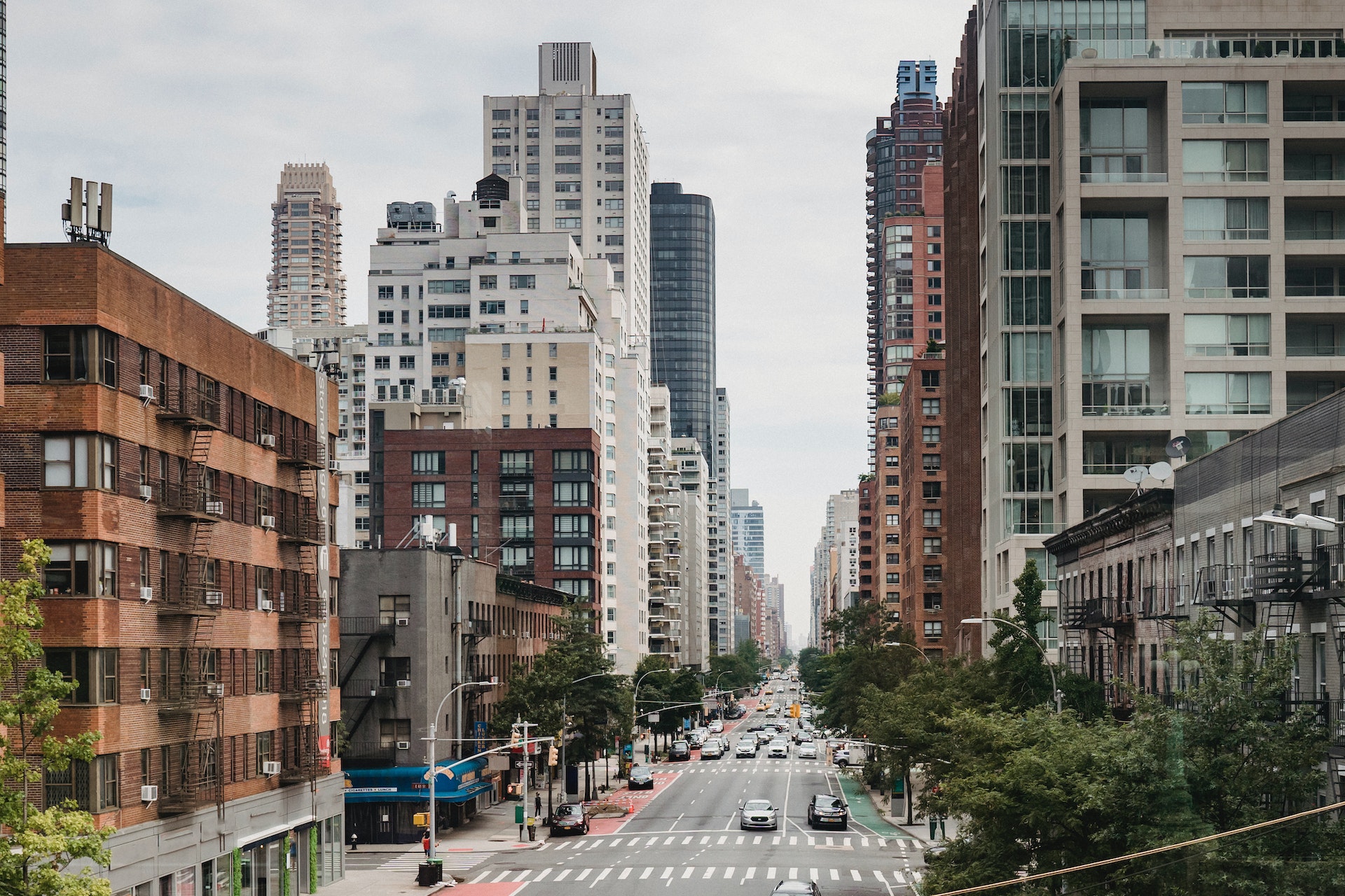 a city street filled with lots of tall buildings