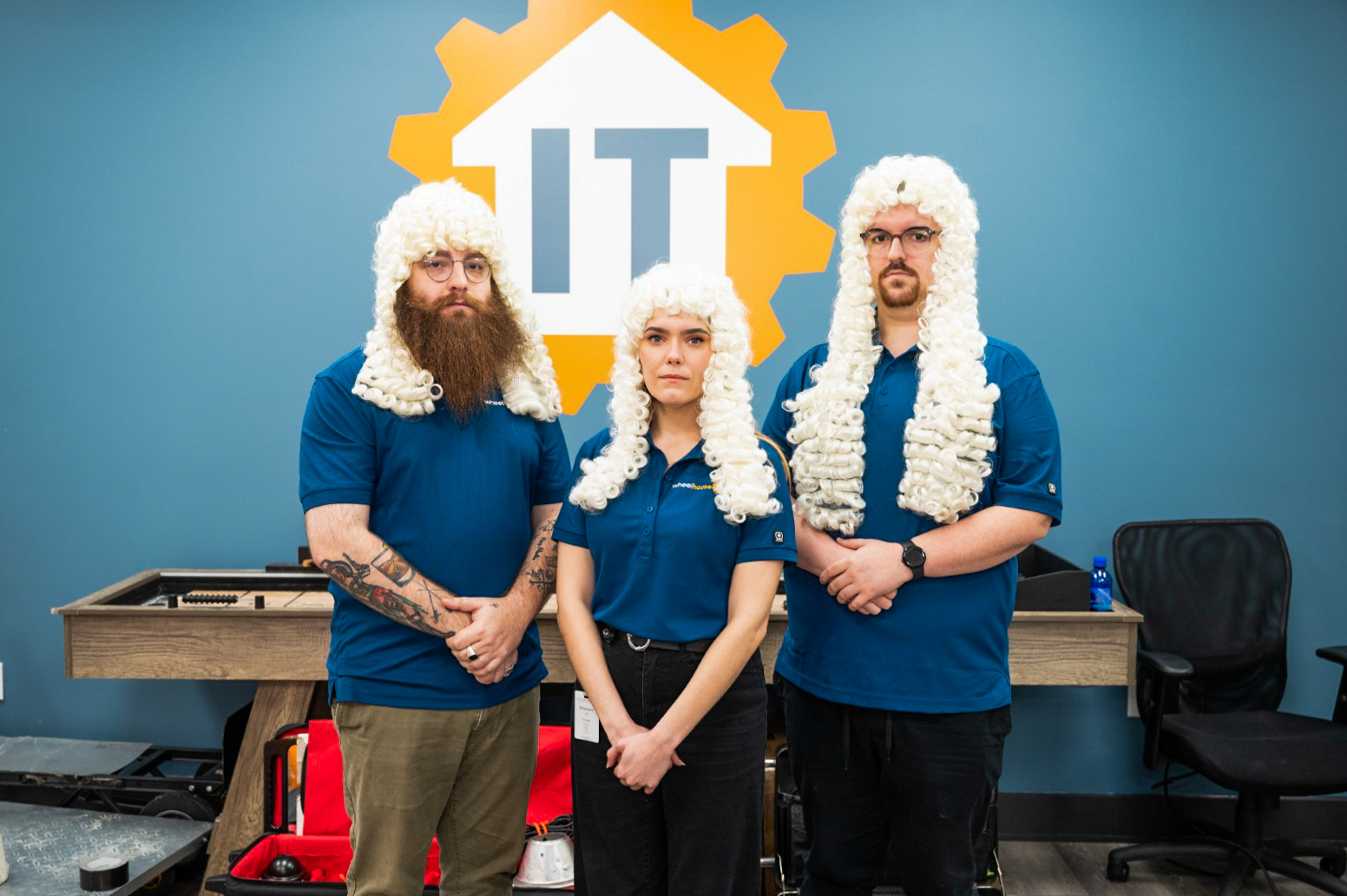 three people wearing wigs and beards in front of a blue wall. it support provider fort lauderdale