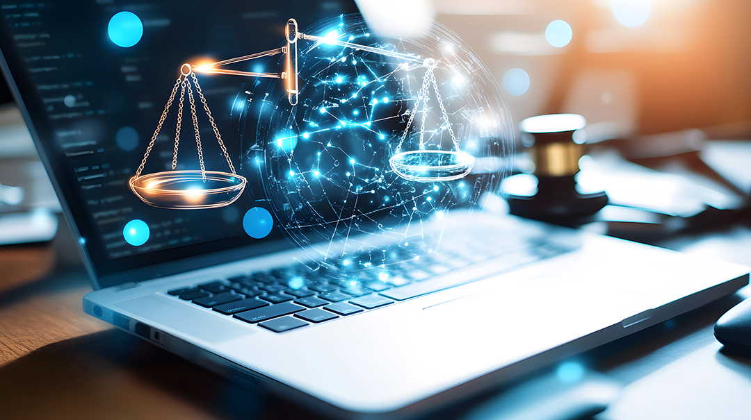 digital scales of justice on laptop.