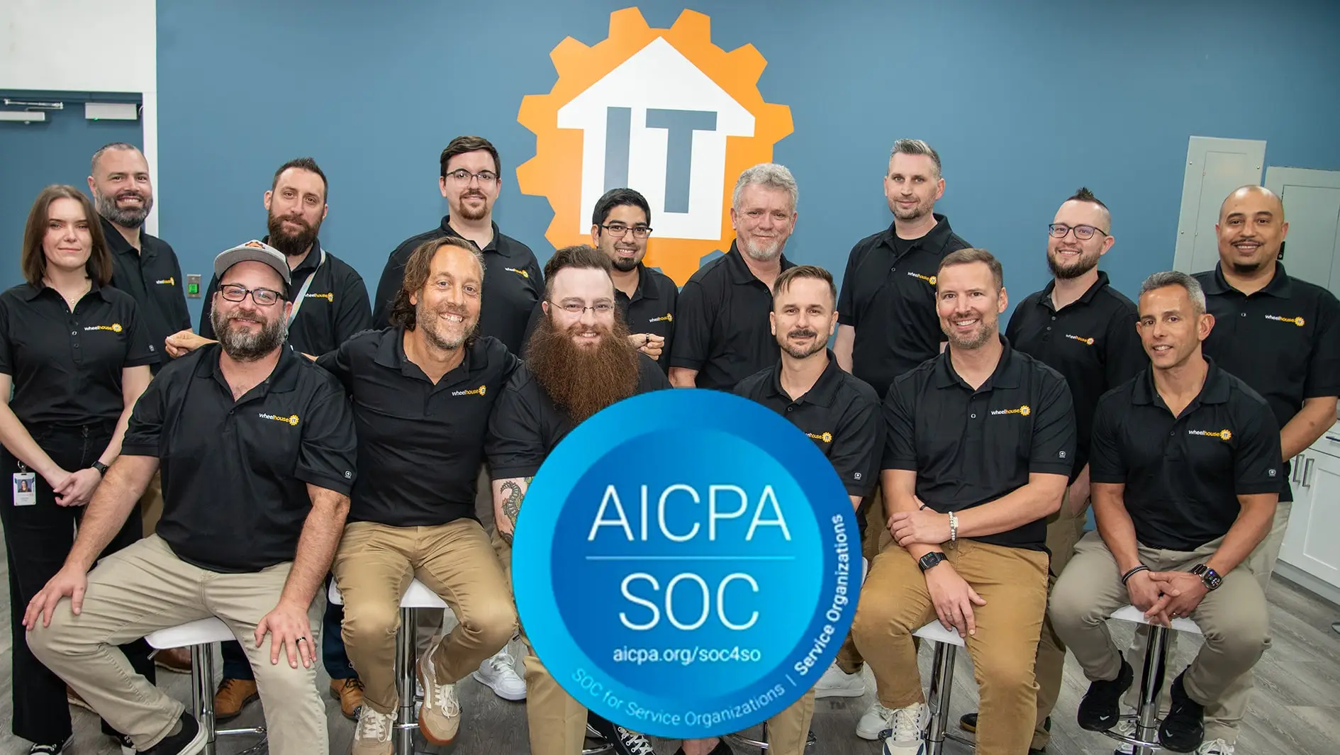 wheelhouse it team celebrates soc 2 compliance with an aicpa soc sign.