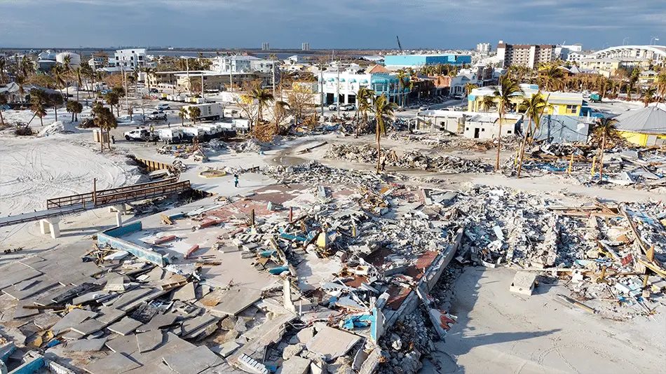 Hurricane Damage Devastates Coastal Businesses As Recovery Crews Clear Rubble Near The Waterfront. hurricane damage devastates coastal businesses as recovery crews clear rubble near the waterfront.