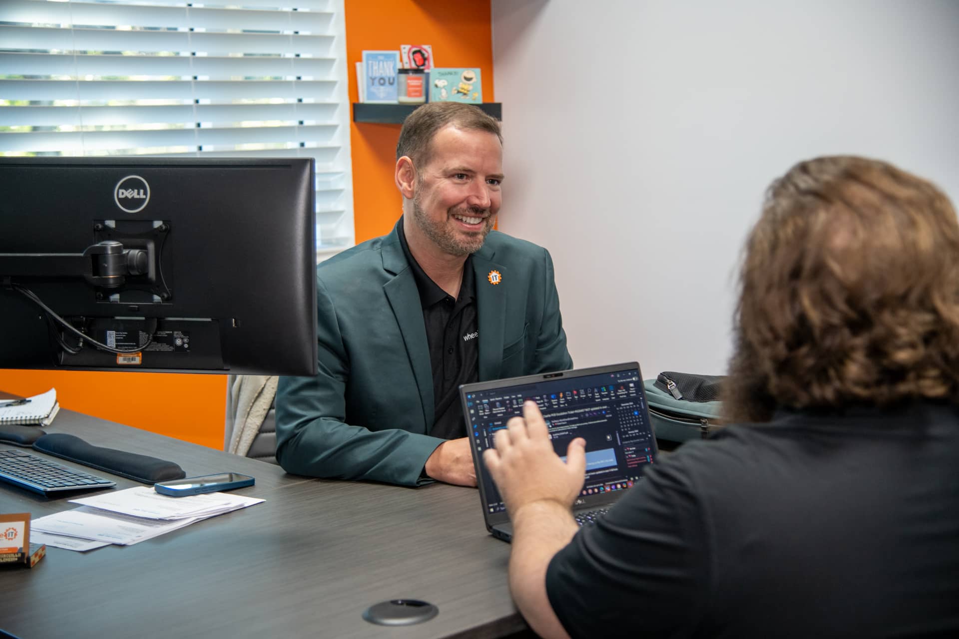 professional discussion in modern office setting with vibrant decor and engaged individuals.