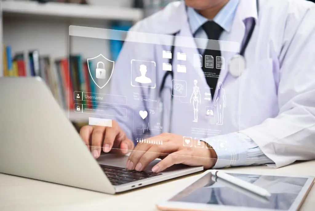 Physician Managing Secure Patient Data On A Laptop For Hipaa Compliance In 2026. physician managing secure patient data on a laptop for hipaa compliance in 2026.