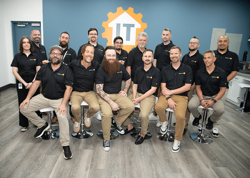 professional it team showcasing unity and diversity in a modern office environment.