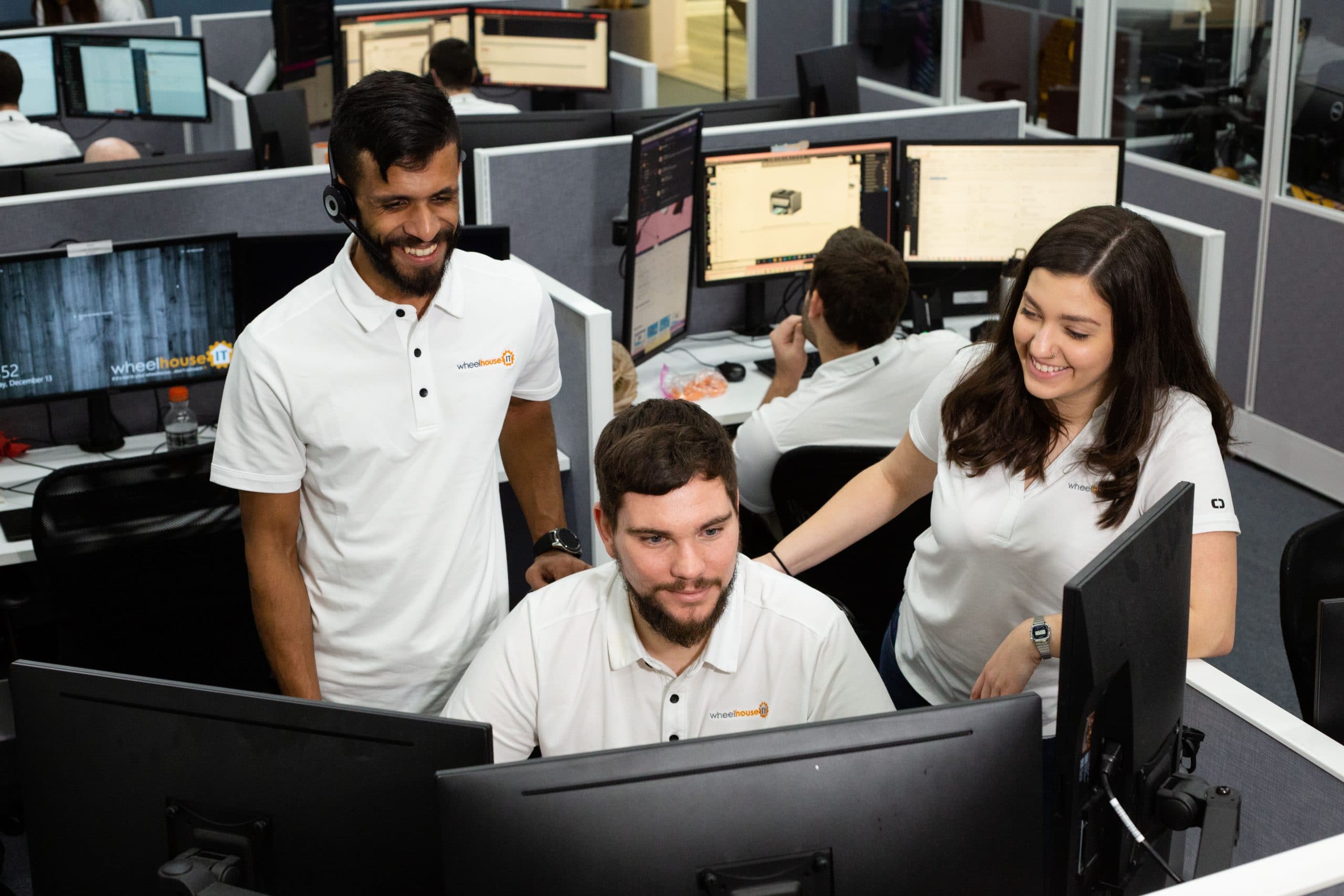 modern collaborative workspace with professionals engaged in tasks, fostering teamwork and productivity.