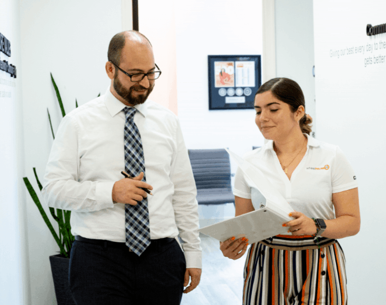 professional collaboration in modern office setting, showcasing mentorship and teamwork dynamics.