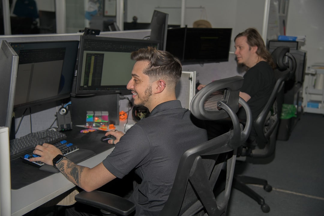 tech professionals collaborate in modern, sleek office space designed for efficiency and innovation.