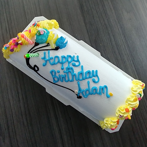 vibrant birthday cake with colorful decorations for festive celebration.