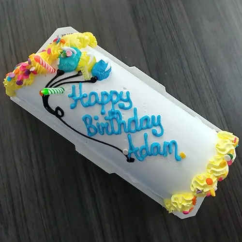 vibrant birthday cake with colorful decorations for festive celebration.