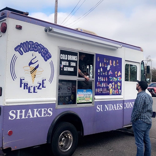 twistee freeze ice cream truck serving colorful treats on a sunny day.