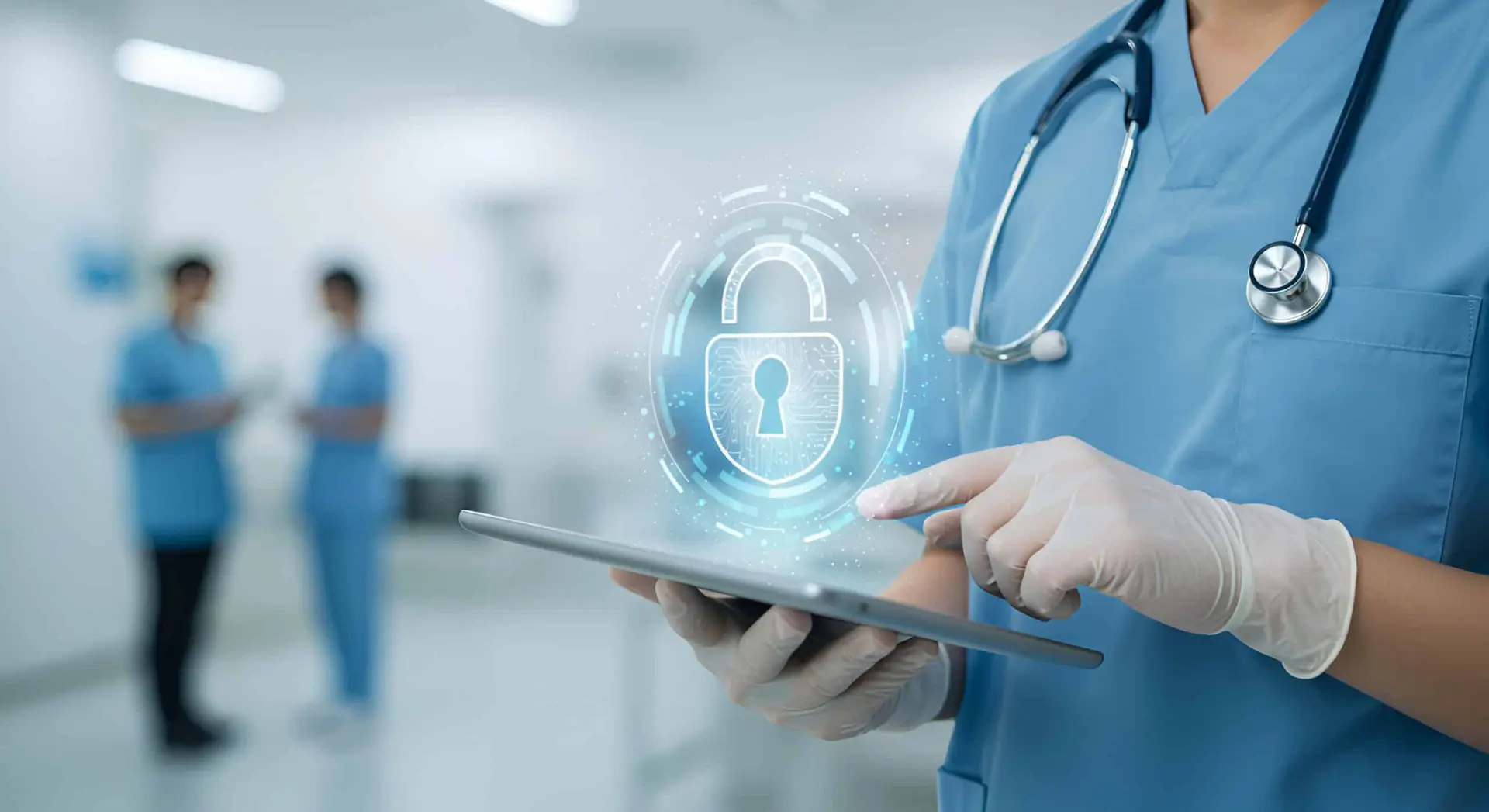 healthcare professional uses a secure tablet, highlighting stryker hack cybersecurity risks.
