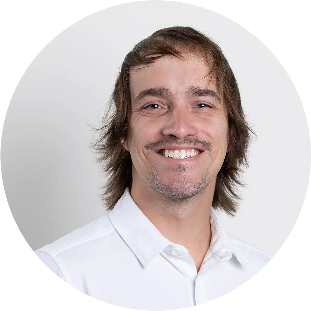 smiling management team professional in a white shirt.