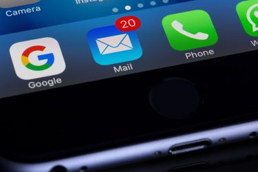 an iphone with several different app icons on the screen