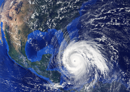 satellite view of powerful hurricane in gulf of mexico, showcasing swirling clouds and eye.